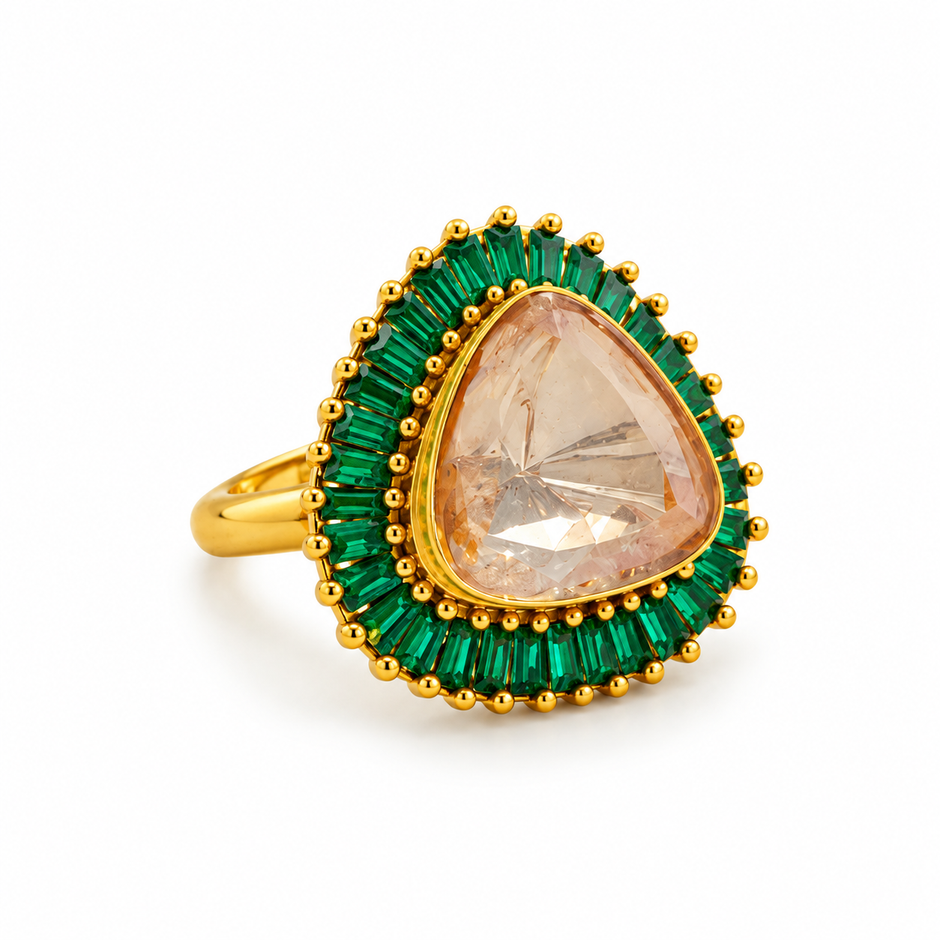 Bhavmayi gold-tone statement ring with green rectangular stones surrounding a large rounded triangular centre