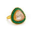 Bhavmayi gold-tone statement ring with green rectangular stones surrounding a large rounded triangular centre