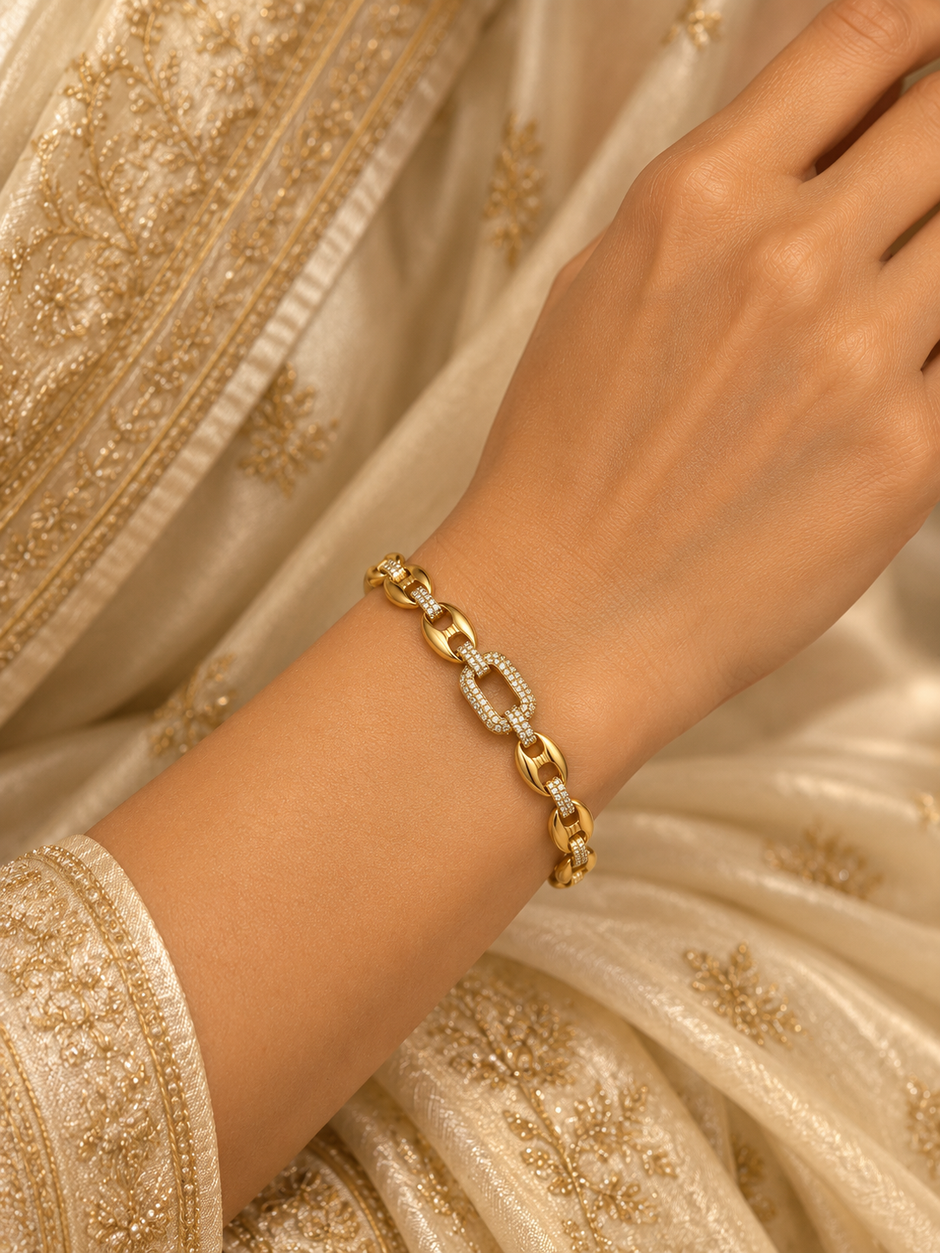 Gold-tone link bracelet with three rectangular purple, pink and green stones in square clear-stone settings, shown from the front and reverse.