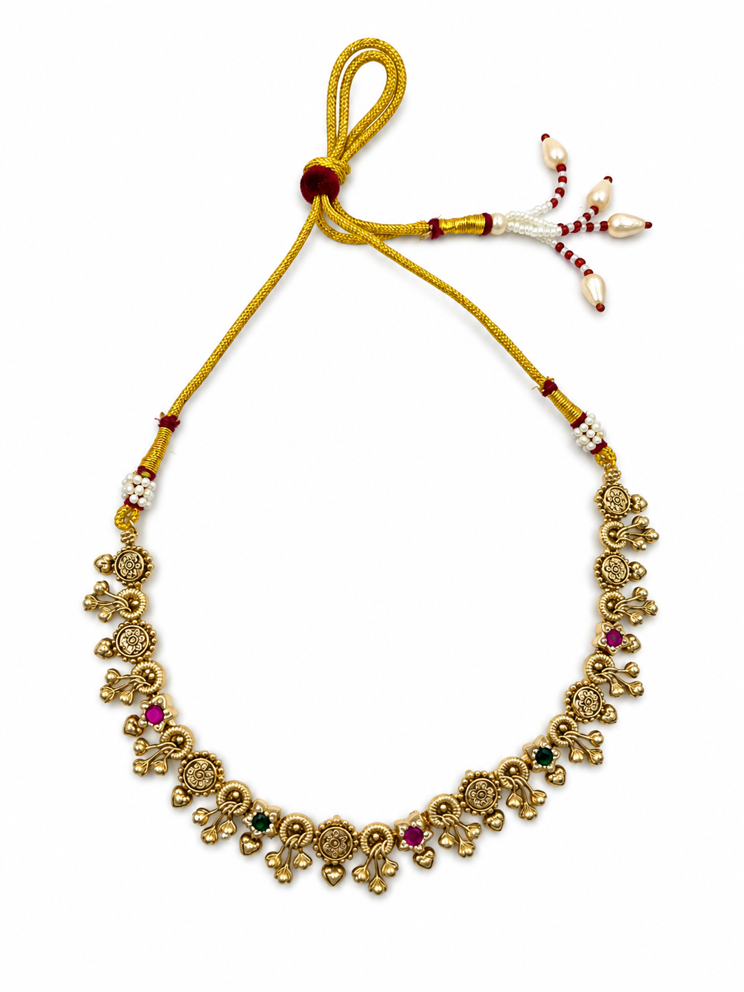 Traditional gold-tone floral necklace set with matching dangling earrings, featuring magenta and green accents, ivory-white bead-like details and intricate ornamental motifs.