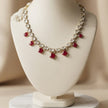 Bhavmayi Antique Gold Polki Kundan Necklace Set with Crimson Ruby Red Gemstone Drops and Matching Earrings