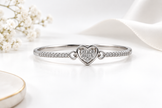 Silver-tone heart, Gold-tone statement ring, Gold-tone oval bangle bracelet detailed heart-shaped centrepiece and a repeating link-style band.
