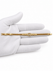 Gold-tone bracelet featuring angular geometric links, a rectangular central embellishment bordered with clear reflective stones, and fine interlocking chain ends.