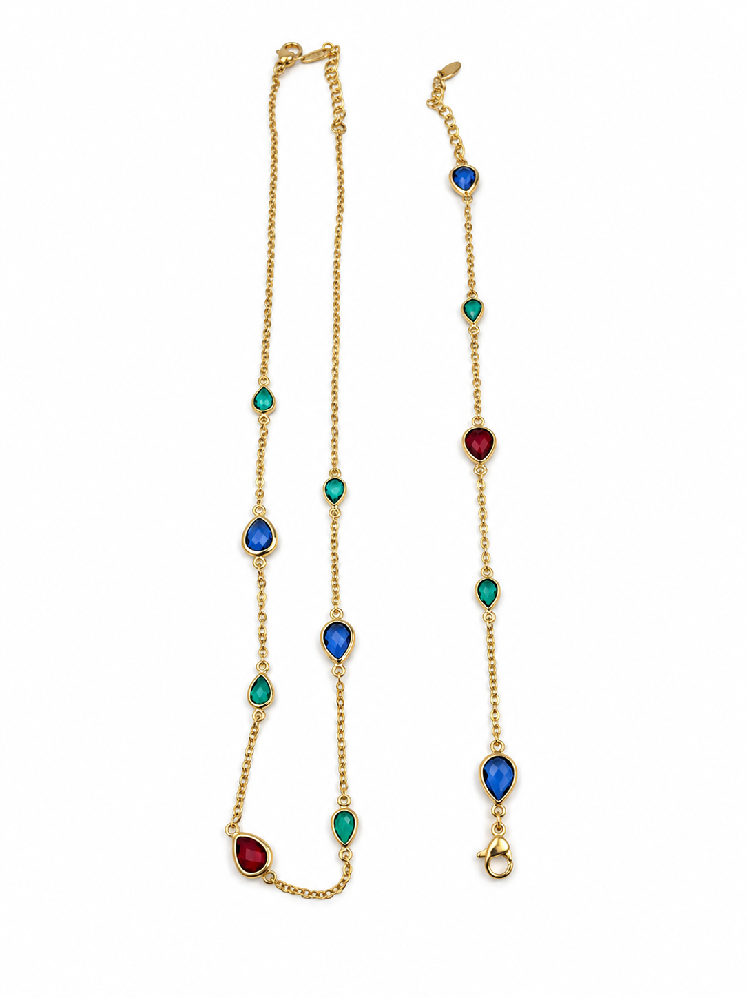Gold-tone necklace and matching bracelet featuring delicate chains with spaced blue, teal green and burgundy red decorative accents, displayed on a model and separately.