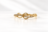 Silver-tone heart, Gold-tone statement ring, Gold-tone oval bangle bracelet detailed heart-shaped centrepiece and a repeating link-style band.
