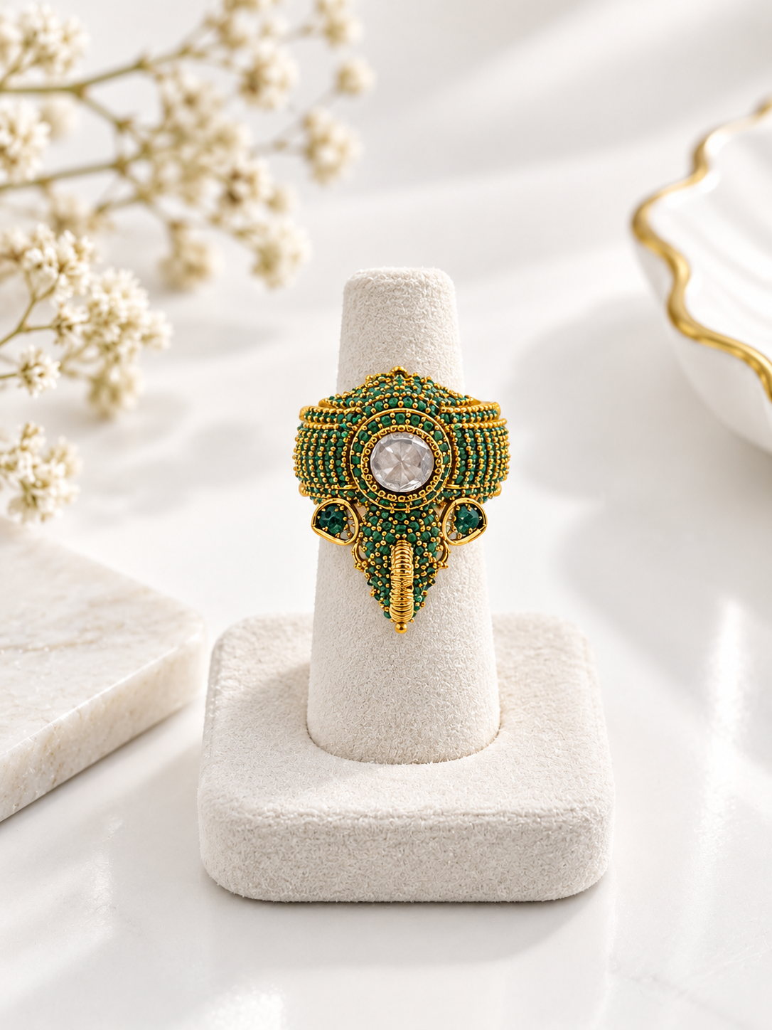 Bhavmayi green beaded statement ring with round clear centre and intricate gold-tone detailing