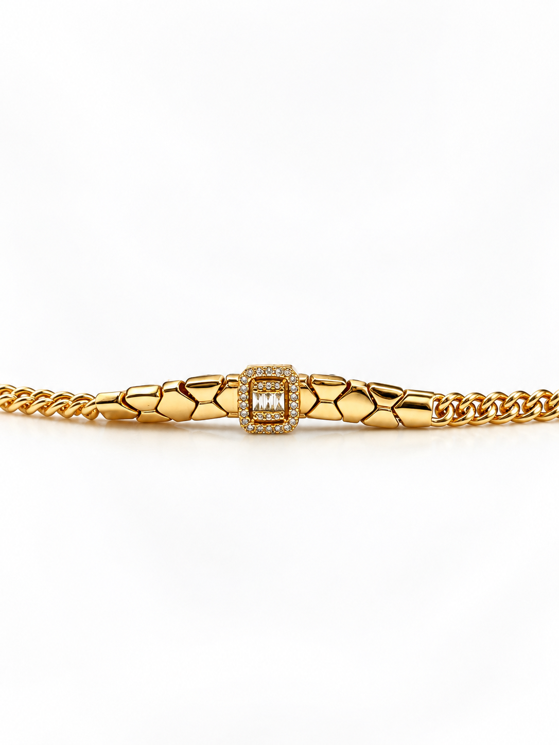 Gold-tone bracelet featuring angular geometric links, a rectangular central embellishment bordered with clear reflective stones, and fine interlocking chain ends.