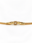Gold-tone bracelet featuring angular geometric links, a rectangular central embellishment bordered with clear reflective stones, and fine interlocking chain ends.
