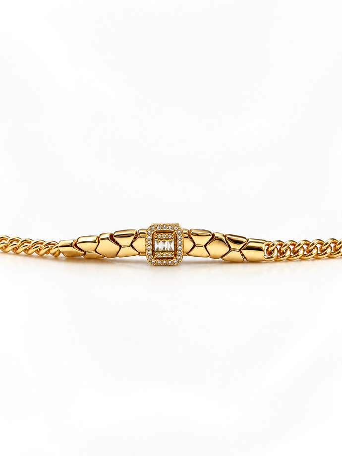 Gold-tone bracelet featuring angular geometric links, a rectangular central embellishment bordered with clear reflective stones, and fine interlocking chain ends.