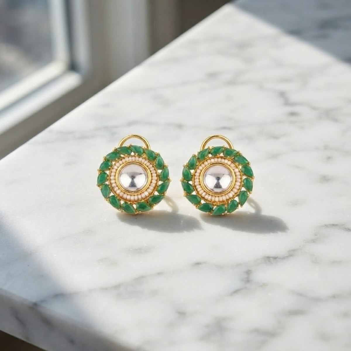 Bhavmayi Gold Plated Round Polki Kundan Stud Earrings with Pearl Halo and Pear Cut Emerald Green Gemstone Wreath