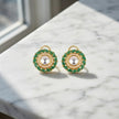 Bhavmayi Gold Plated Round Polki Kundan Stud Earrings with Pearl Halo and Pear Cut Emerald Green Gemstone Wreath