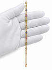Gold-tone chain bracelet featuring geometric golden links and multicoloured blue, purple, pink, green and clear decorative accents, shown separately and worn on a wrist.