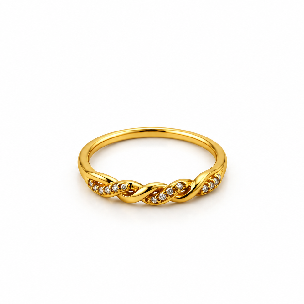 Gold-tone ring with a slender band, flowing interlacing wave pattern and small clear reflective accents, displayed on a white background and worn on a finger.