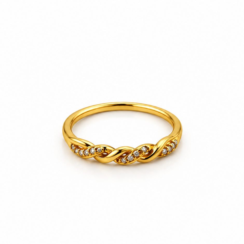 Gold-tone ring with a slender band, flowing interlacing wave pattern and small clear reflective accents, displayed on a white background and worn on a finger.