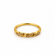 Gold-tone ring with a slender band, flowing interlacing wave pattern and small clear reflective accents, displayed on a white background and worn on a finger.