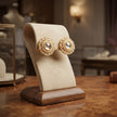 Bhavmayi Gold Plated Round Polki Kundan Stud Earrings with Pearl Halo and Pear Cut Emerald Green Gemstone Wreath