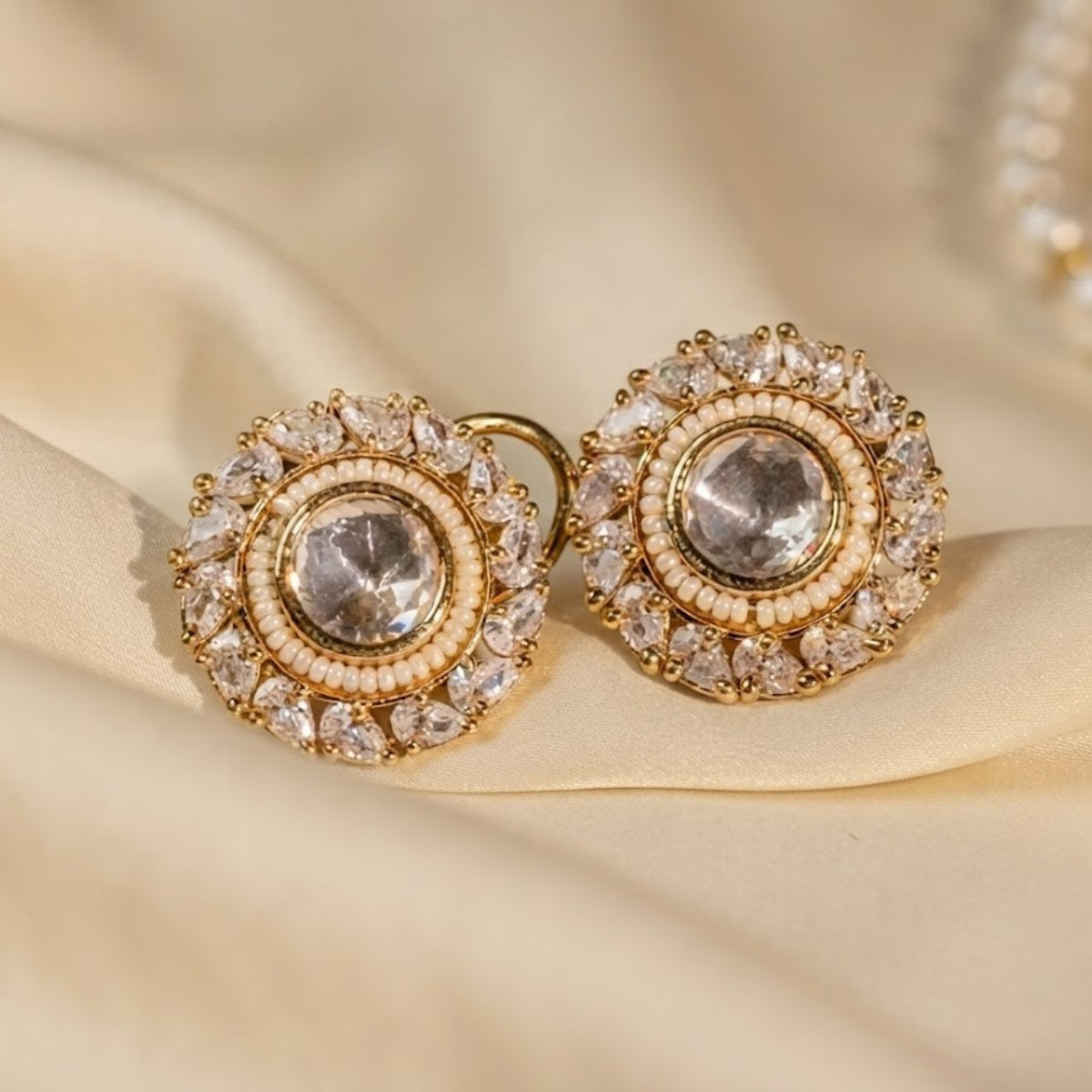 Bhavmayi Gold Plated Round Polki Kundan Stud Earrings with Pearl Halo and Pear Cut Emerald Green Gemstone Wreath