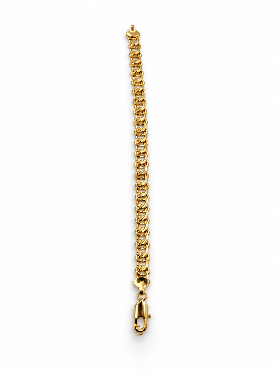 Gold-tone bracelet featuring a continuous chain of rounded interlocking links with a twisted appearance, shown separately and worn around a woman's wrist.