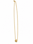 Gold-tone necklace with a fine linked chain and a small layered curved pendant featuring clear reflective stones, displayed on a black jewellery bust and a white gloved hand.