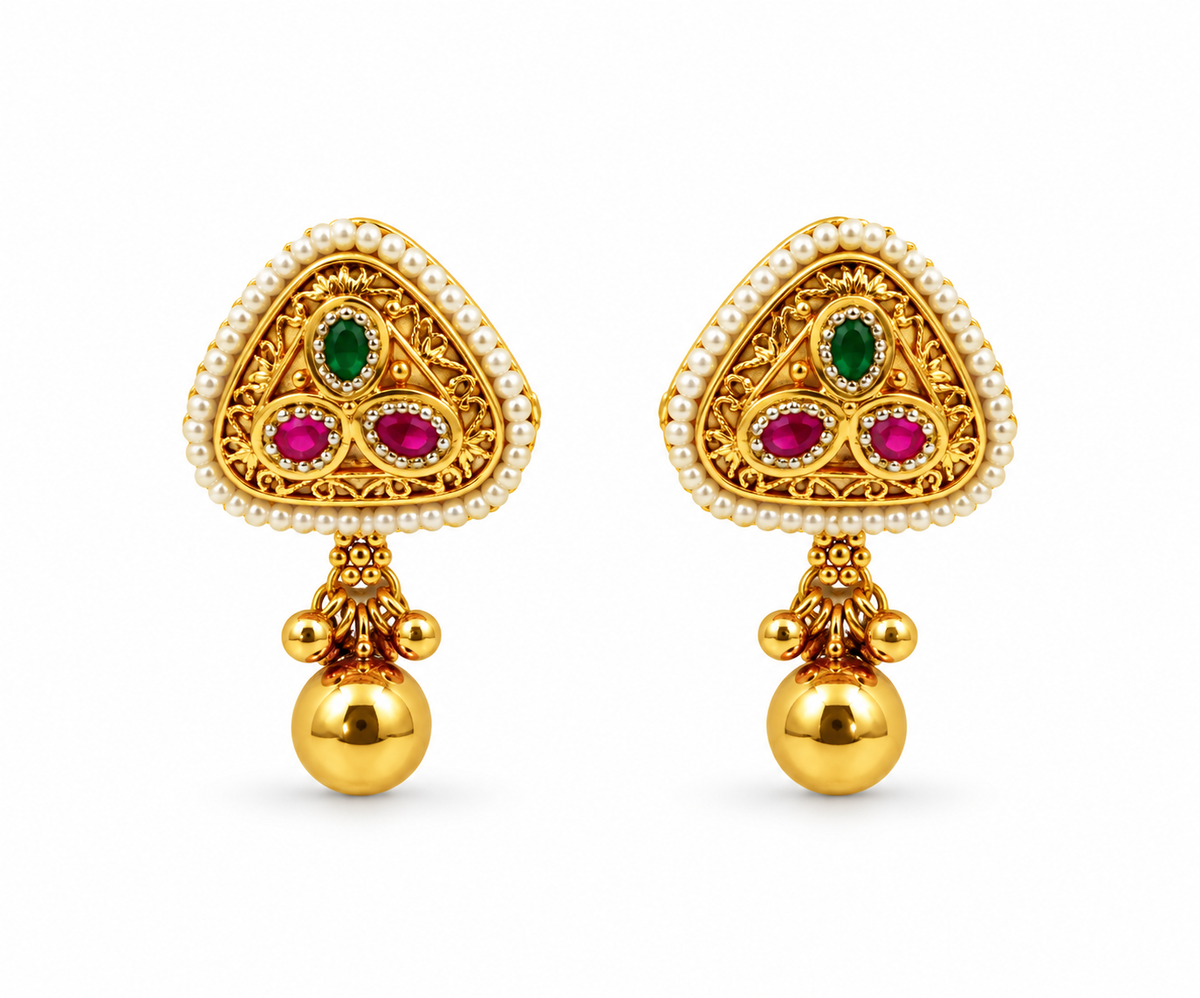 Gold-tone temple necklace set displayed on a white jewellery bust, featuring a decorative pendant with green and magenta accents, a beaded chain, and matching triangular drop earrings.