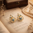 Bhavmayi Elegant 14K Gold Filigree Handmade Teardrop Studs with Coral & Pearl Accents