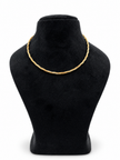 Delicate gold and silver-tone multi-strand chain necklace with an intertwined twisted-link pattern and clasp closure, displayed on a black necklace stand.