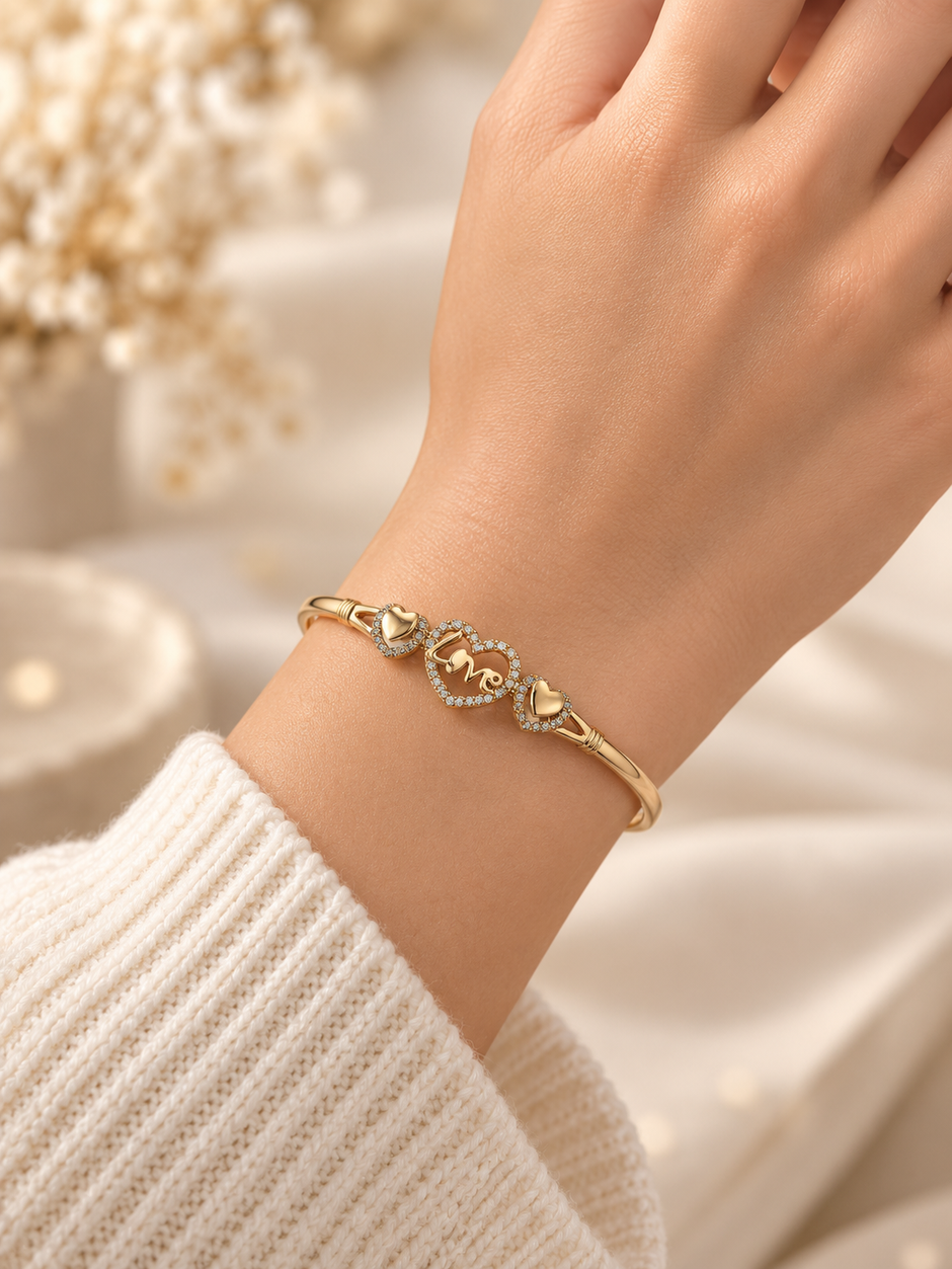 Silver-tone heart, Gold-tone statement ring, Gold-tone oval bangle bracelet detailed heart-shaped centrepiece and a repeating link-style band.