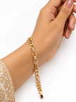 Bhavmayi golden bracelets with varied link designs and clear sparkling stone-like accents shown worn on the wrist