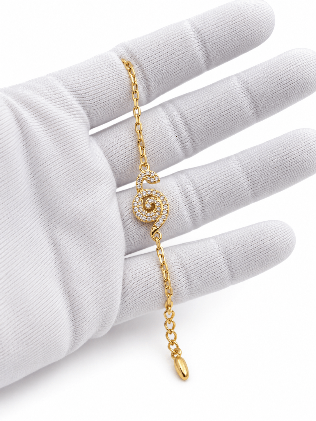 Bhavmayi gold-tone bracelet with a spiral motif covered in clear reflective accents and a delicate chain - bhavmayi