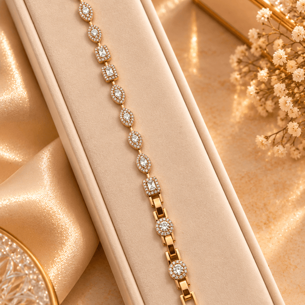 Golden bracelet with alternating oval and square clear sparkling accents and geometric link detailing