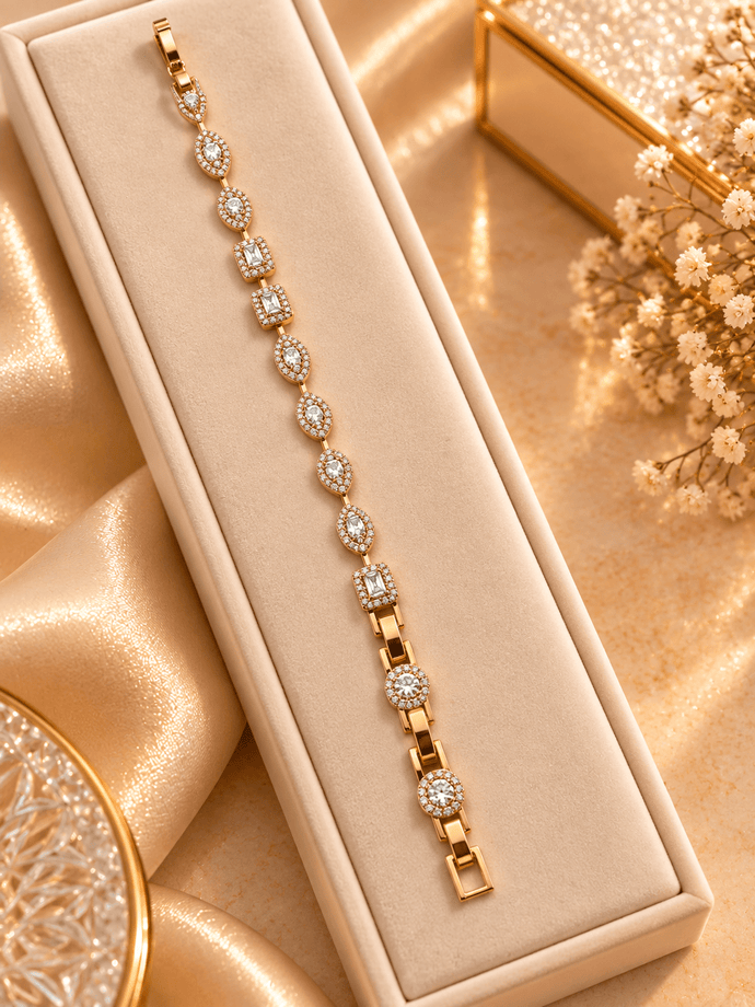 Golden bracelet with alternating oval and square clear sparkling accents and geometric link detailing