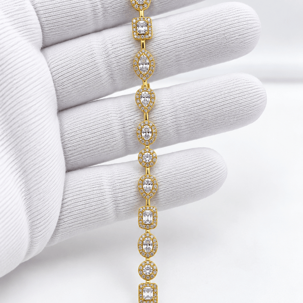 Golden bracelet with alternating oval and square clear sparkling accents and geometric link detailing