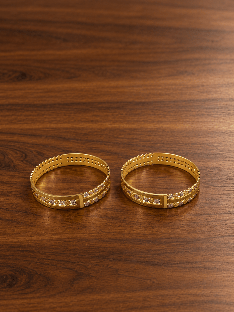 Bhavmayi gold-tone kada bangle set with repeating clear accents and intricate decorative detailing - bhavmayi