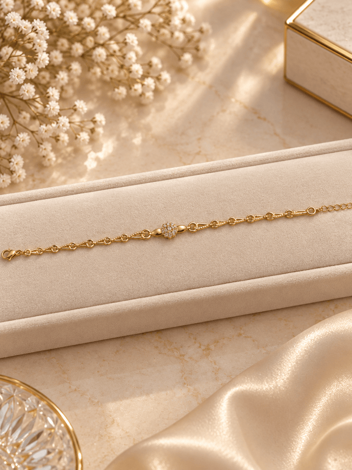 Bhavmayi gold-tone link bracelet with textured rounded centre bead, detailed chain links and extension chain - bhavmayi