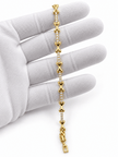 Bhavmayi gold-tone linked bracelet featuring curved decorative links and a central row of clear stone-like accents - bhavmayi