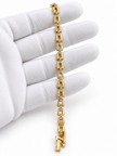 Bhavmayi gold-tone linked bracelet featuring curved decorative links and a central row of clear stone-like accents - bhavmayi