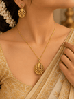 Bhavmayi gold-tone necklace and matching earrings featuring elongated leaf motifs with intricate open lattice detailing - bhavmayi