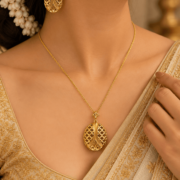 Bhavmayi gold-tone necklace and matching earrings featuring elongated leaf motifs with intricate open lattice detailing - bhavmayi