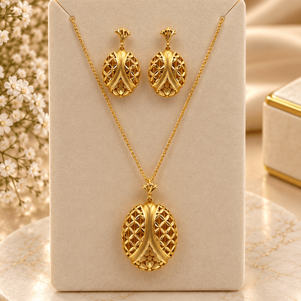 Bhavmayi gold-tone necklace and matching earrings featuring elongated leaf motifs with intricate open lattice detailing - bhavmayi