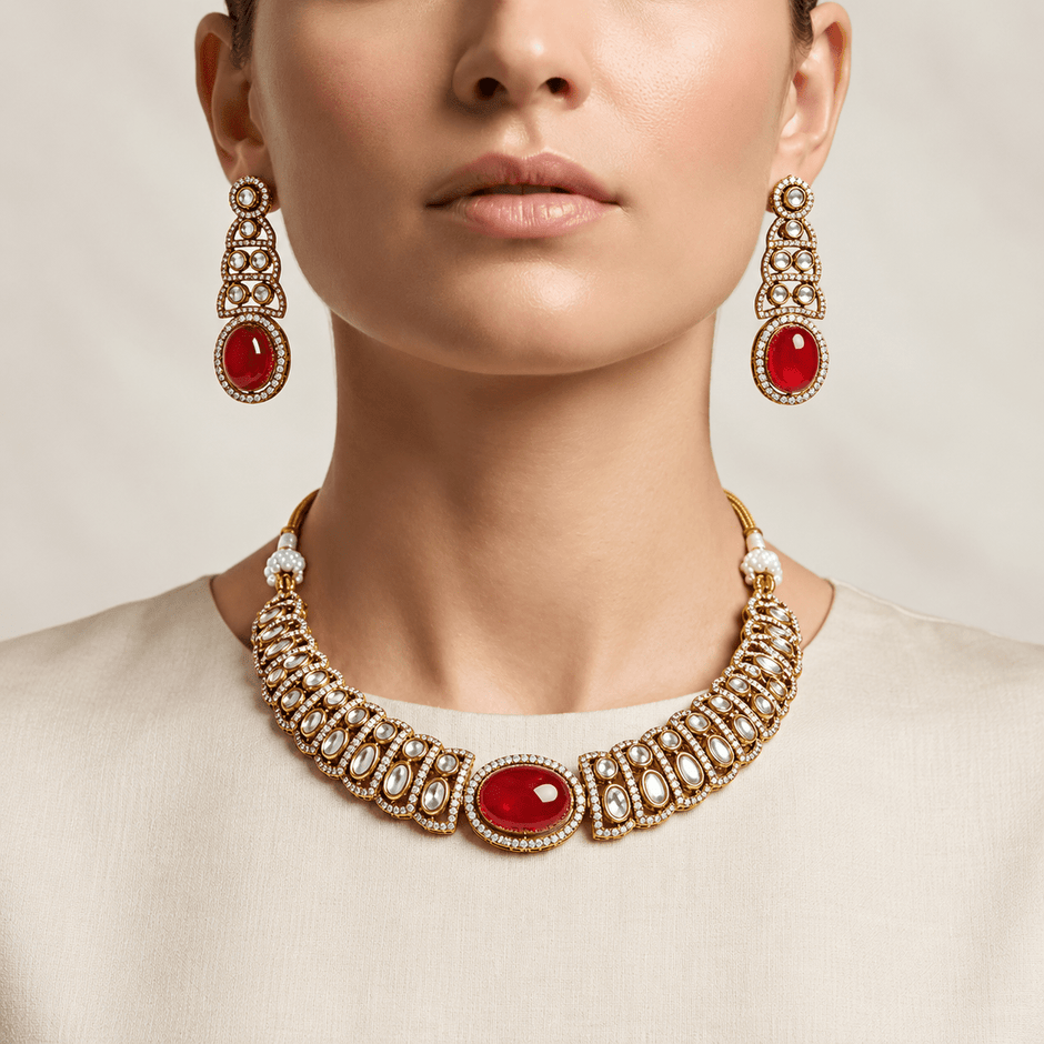 Bhavmayi gold-tone necklace set with green oval stones, white decorative accents and matching drop earrings - bhavmayi