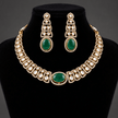 Bhavmayi gold-tone necklace set with green oval stones, white decorative accents and matching drop earrings - bhavmayi