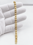 Bhavmayi gold-tone oval link bracelet with repeating clear accents and rounded decorative connectors - bhavmayi