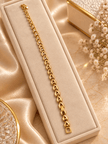Bhavmayi gold-tone oval link bracelet with repeating clear accents and rounded decorative connectors - bhavmayi