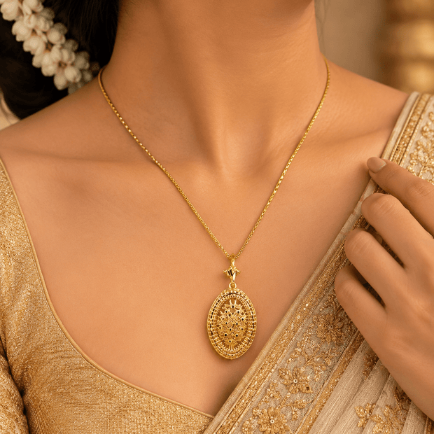 Bhavmayi gold-tone oval necklace and matching earrings with intricate floral and geometric medallion detailing - bhavmayi