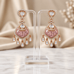 Bhavmayi gold-tone teardrop necklace and matching earrings shown with pink and green centre accent variations - bhavmayi