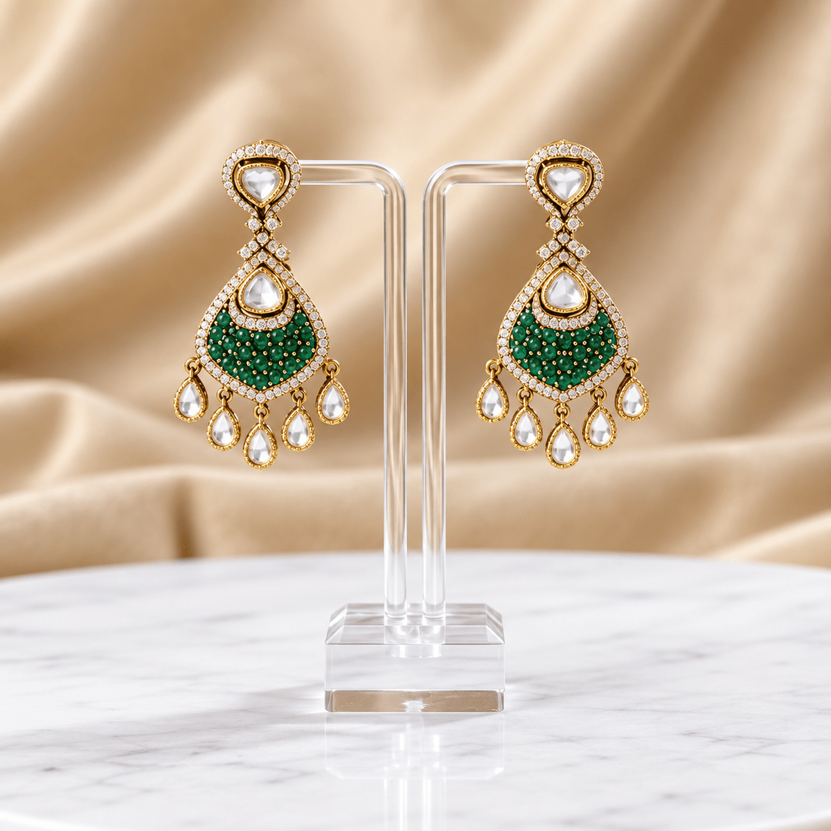 Bhavmayi gold-tone teardrop necklace and matching earrings shown with pink and green centre accent variations - bhavmayi
