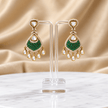 Bhavmayi gold-tone teardrop necklace and matching earrings shown with pink and green centre accent variations - bhavmayi