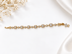 Bhavmayi golden link bracelet with curved embellished motifs, geometric clear accents and a visible clasp