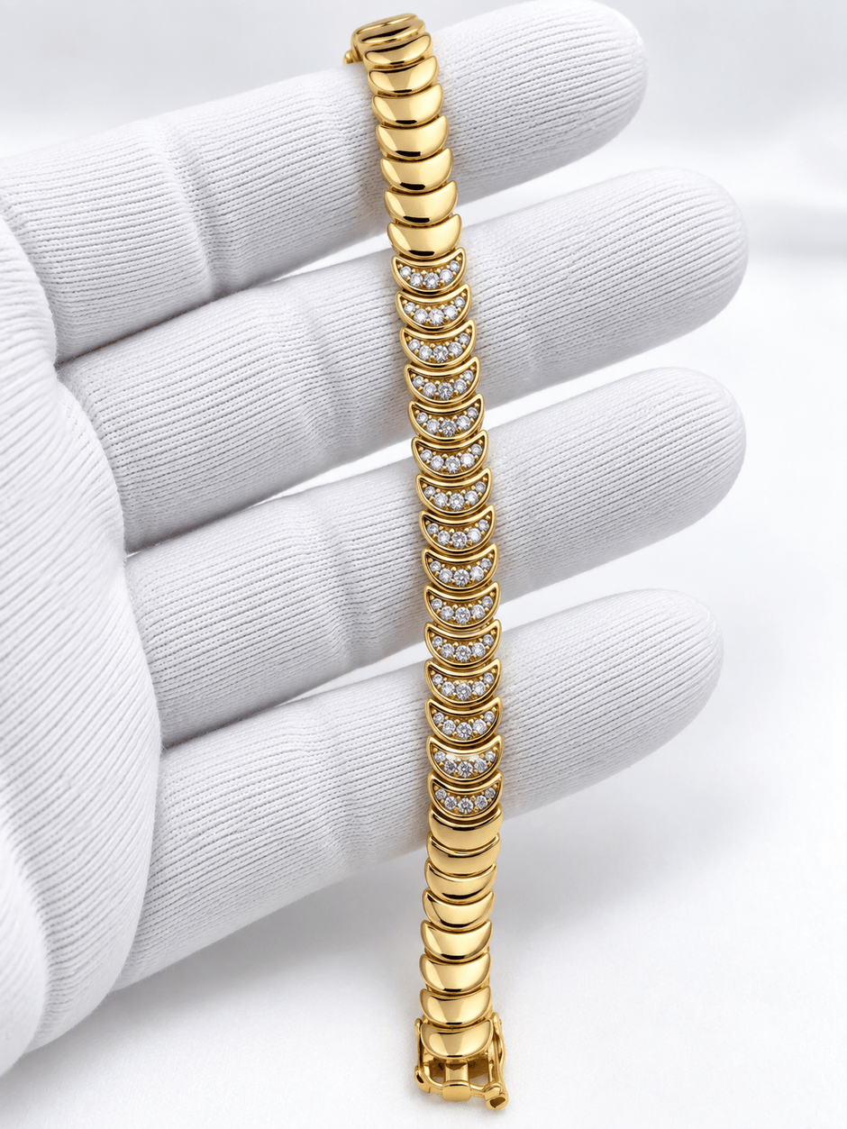 Bhavmayi golden link bracelet with curved embellished motifs, geometric clear accents and a visible clasp