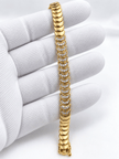 Bhavmayi golden link bracelet with curved embellished motifs, geometric clear accents and a visible clasp